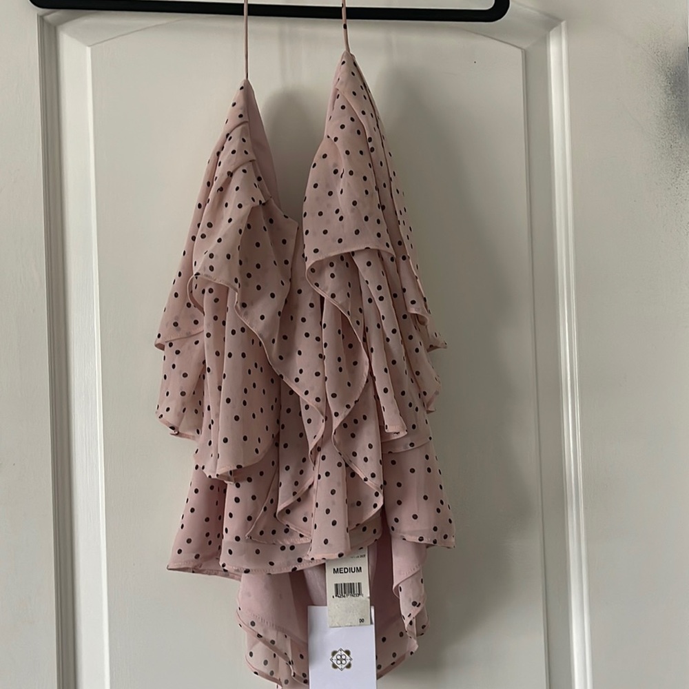 Flouncy pink and black polka dots top with shoulder tie